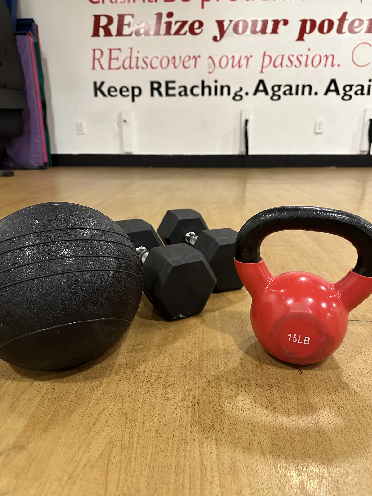 Kettlebell row reflected in the studio mirror, used for REal Fit